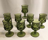 Group of eight green thumbprint goblets