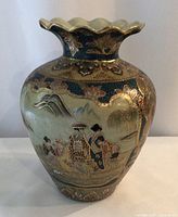 Full front view of Satsuma vase showing figural scene and shape