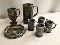 Group showing stein, mug, ashtray, four demitasse cups
