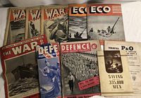 Top view of full assortment of war magazines and booklet