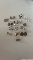 All 15 earring pairs arranged upright for full view of styles and embellishments