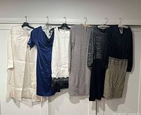 Group shot of all six garments hanging
