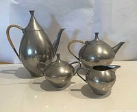 Four-piece chrome-plated pewter set front view