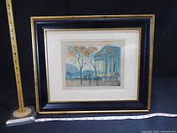 Framed watercolour with measuring tape for scale