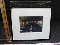 Front view of framed signed print