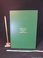 Front of large green hardcover book with title