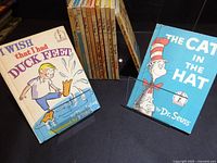 Two featured books and vertical row of additional Dr. Seuss hardcovers