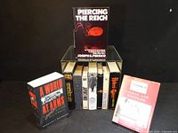 Group shot of all ten books including Piercing the Reich displayed on top and Great Air Battles on the right