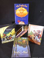 Group shot of five children’s books displaying front covers
