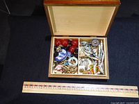 Box open showing assorted costume jewellery