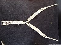Close-up of rhinestone Y necklace