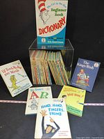 Group shot showing dictionary, five front books and row of additional Beginner Books