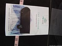 Printed product sheet for reference next to tape measure