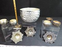 Group showing bowl, four cups, three strainers