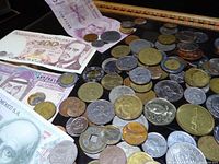 Overview of coins and banknotes on tabletop