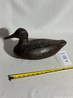 Left profile of full decoy with tape measure for scale