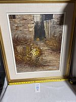 Frontal view of framed painting showing artwork, frame and mat