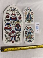 All three ceramic boards with tape for scale