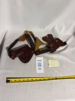 Full shoulder holster rig with measuring tape for scale