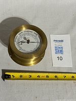 Front and side view with measuring tape showing size and brass casing