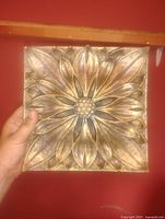 Front view showing full floral relief and finish