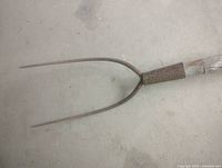 Close-up of cast iron two-prong head and socket