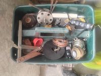 Top view of tote showing assortment of tools and hardware