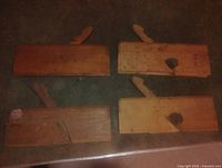 Four wooden hand planes front view