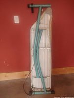 ironing board folded, back view showing frame and legs