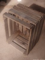 Crate on side showing slat construction and corner supports