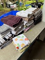 Stacks of assorted towels on table