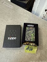 Zippo camouflage lighter in open box with insert