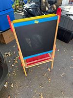 Front view showing chalkboard side, frame and tray