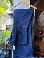 Bluenotes denim overall hanging on hanger