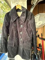 Front view of dark charcoal corduroy Ralph Lauren double-breasted jacket on hanger