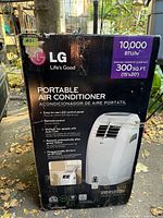 Front of box showing LG branding, 10,000 BTU rating, 300 sq ft coverage