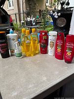 Group shot of all eleven personal-care bottles on table