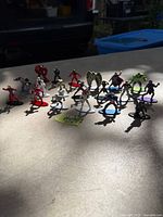 Group shot of all 19 die-cast figures on tabletop