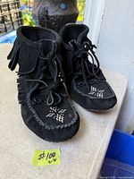 Front view of mukluks showing beadwork and laces