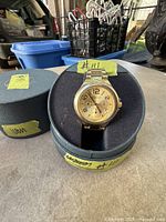 Watch in presentation box showing full bracelet and box exterior