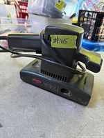 Side view of SKIL electric finishing sander with cord and base