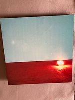 front view of square canvas showing sunset design