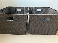 Pair of large dark brown rectangular wicker baskets side by side