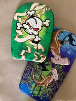 Two boogie boards showing front graphics and overall condition