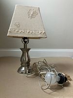 Table lamp with shade and separate work light socket shown together
