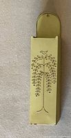 Front view of light green metal wall hanging vessel with bird and branch design