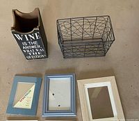 Wine holder, wire basket, three frames visible