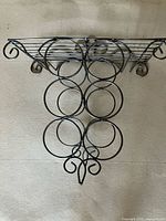 Front view of wall-mounted metal wine rack