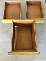 Three yellow wood drawers top view