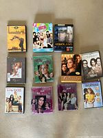 First group of 11 DVD/Blu-ray cases laid out on carpet